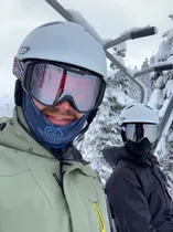 Gavin with friend smiling in ski gear