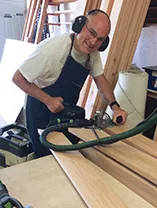 Lauren in garage cutting lumber