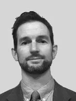 headshot of Matt in a shirt and tie