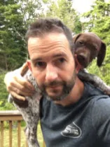 Matt playing with his new puppy