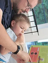 Paul reading to son about volcanoes